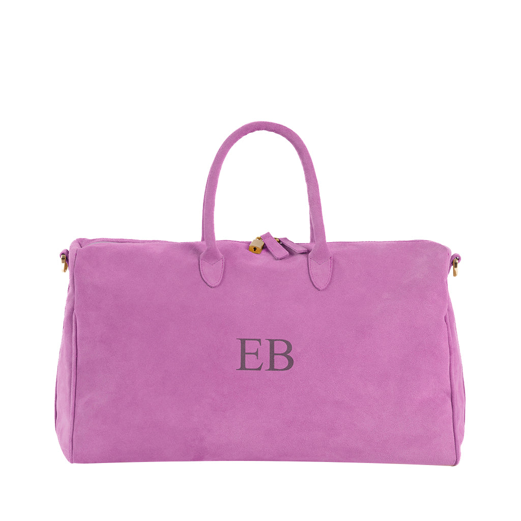 Pink suede handbag with monogram EB on front