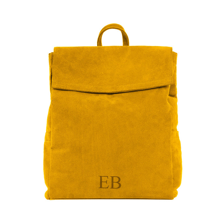 Yellow suede backpack with monogrammed EB on the front