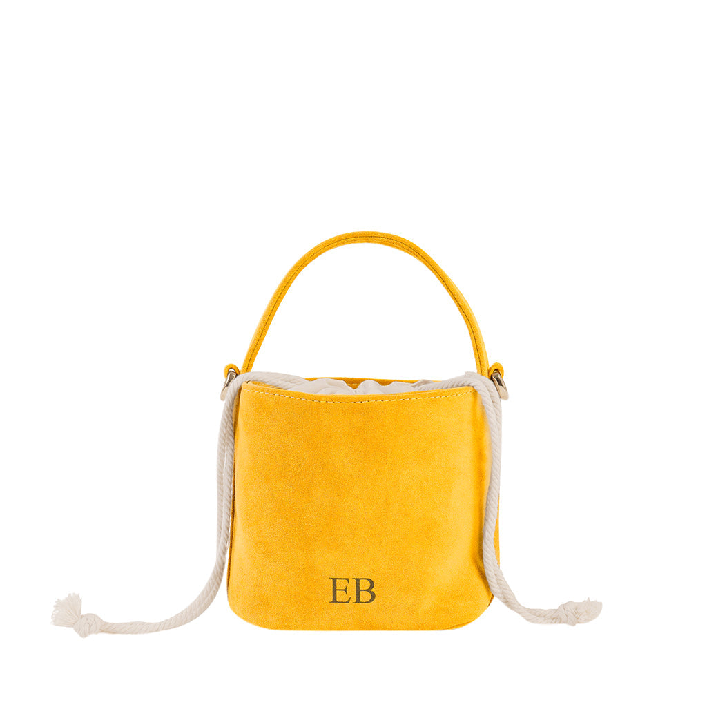 Yellow suede bucket bag with rope handles and embroidered initials EB