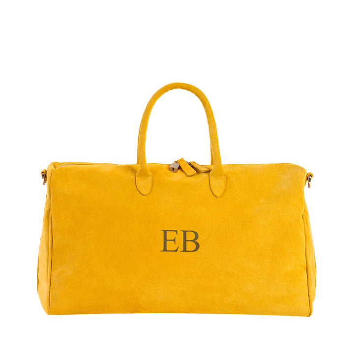 Bright yellow suede duffle bag with initials EB embroidered on the front