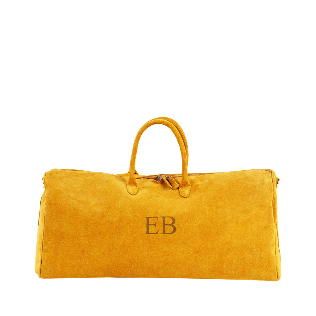 Yellow suede duffel bag with initials 'EB' embroidered