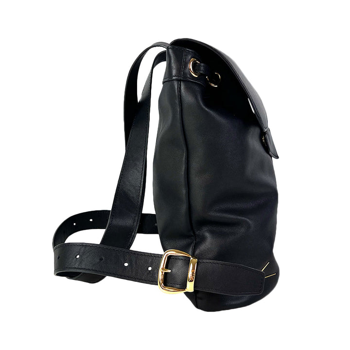 Black leather backpack with gold buckle and adjustable strap