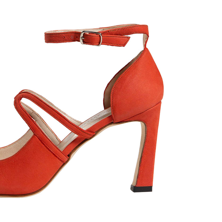 Red high-heeled shoe with ankle strap and open toe design