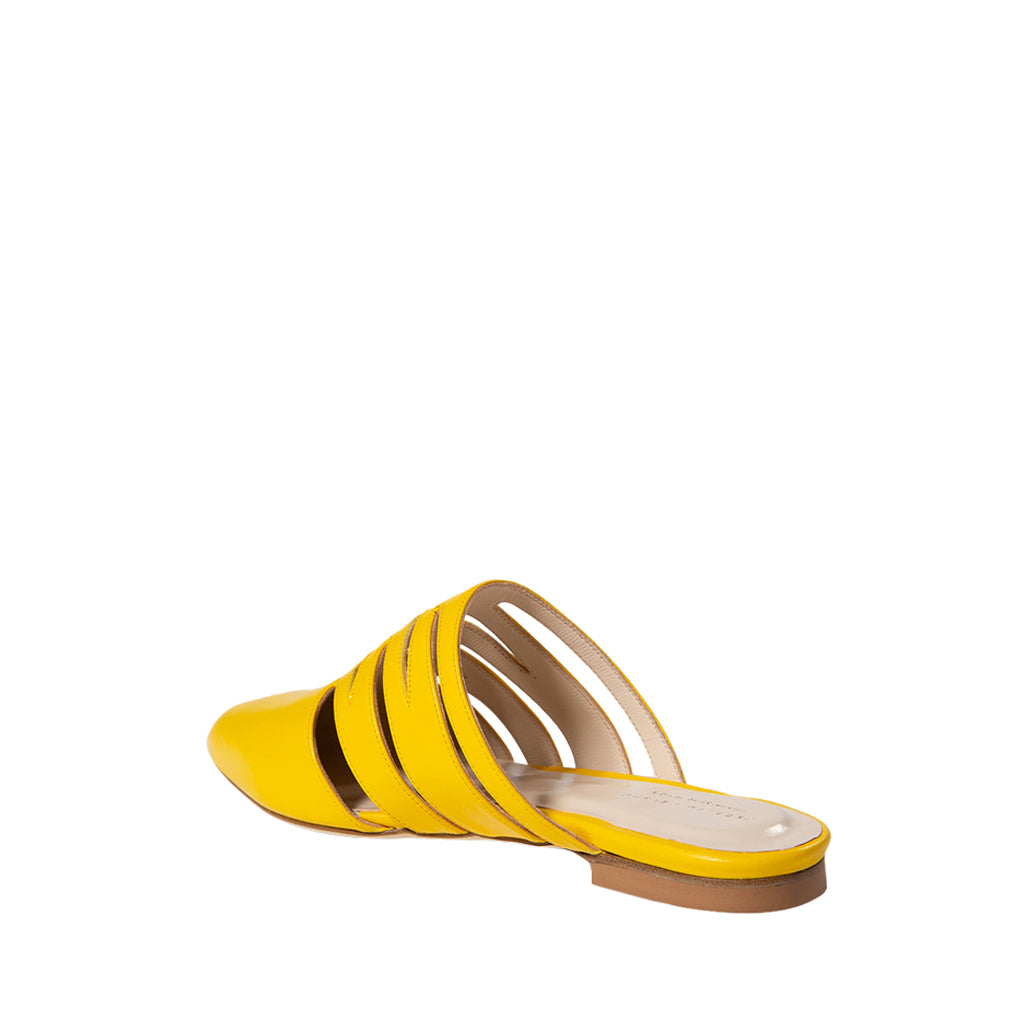 Yellow strappy leather mule sandal on white background