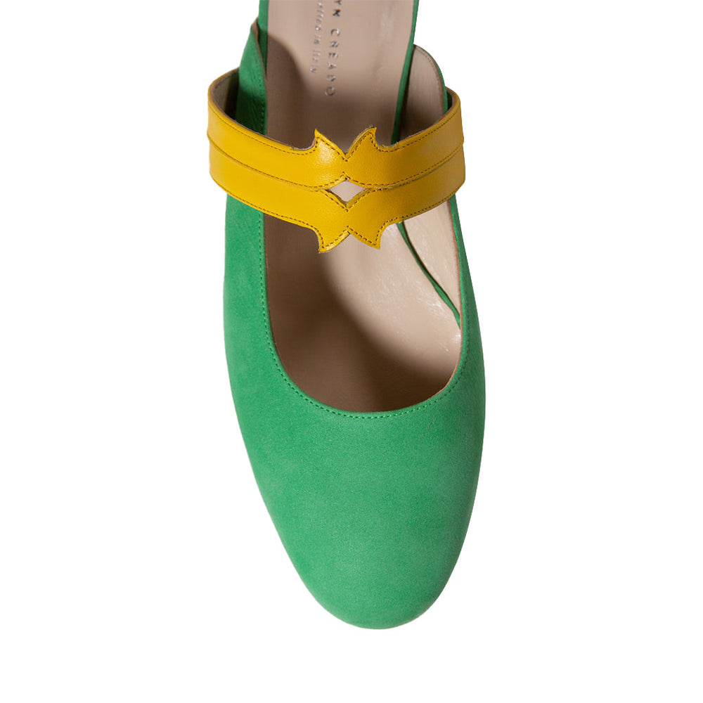 Green suede shoe with a yellow strap
