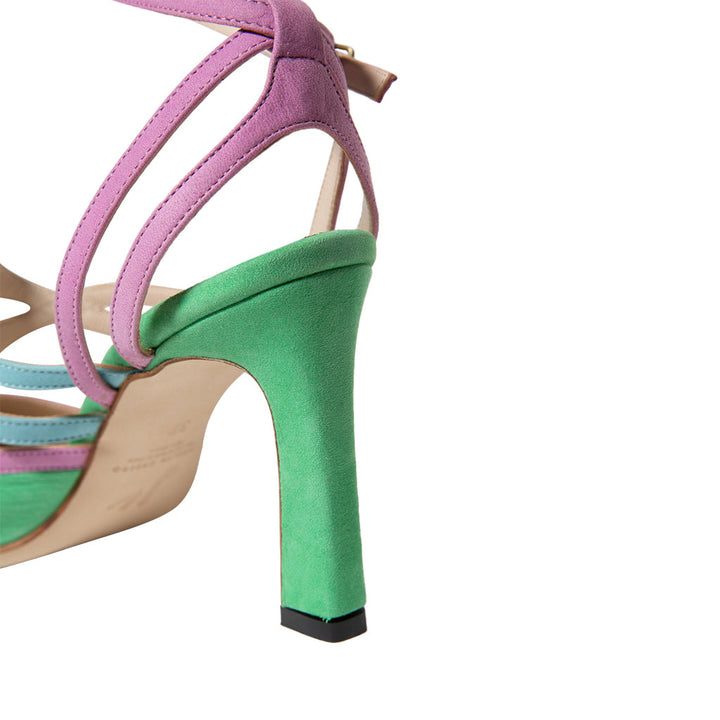 Close-up of multicolored high heel sandal with purple straps and green heel