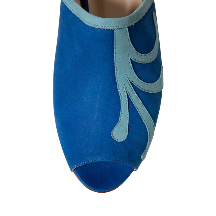 Close-up of a blue peep-toe suede shoe with light blue swirl design