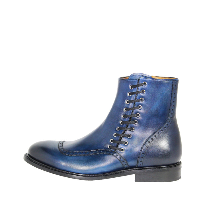 Blue leather wingtip ankle boot with brogue detailing and black laces