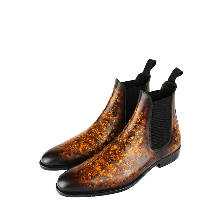 Pair of stylish brown leather Chelsea boots with a textured pattern