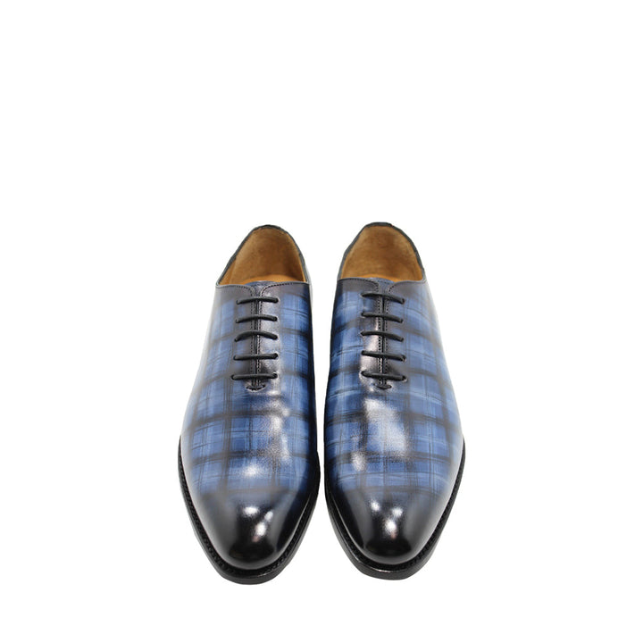 Blue plaid leather dress shoes with black laces, front view