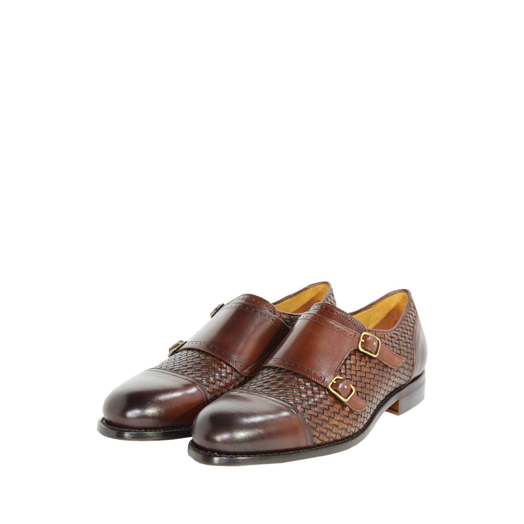 Brown woven leather double monk strap shoes on white background