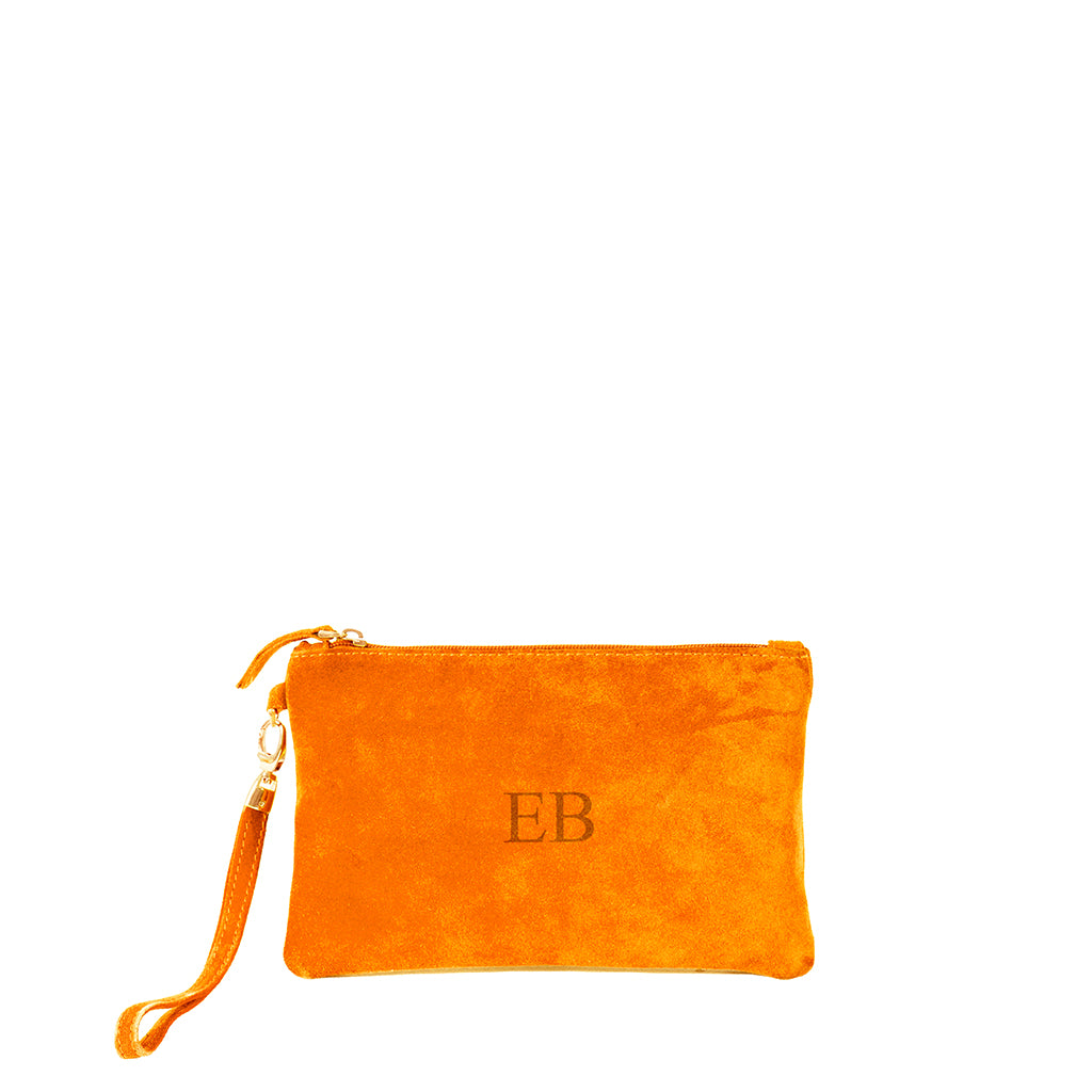 Bright orange suede wristlet pouch with initials EB embroidered on the front