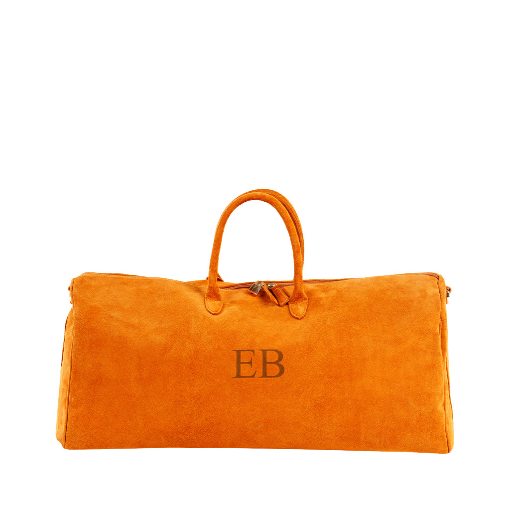 Orange suede duffle bag with monogrammed initials EB and top handles