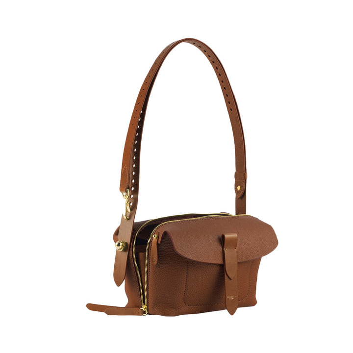 Brown leather handbag with adjustable strap and gold zipper