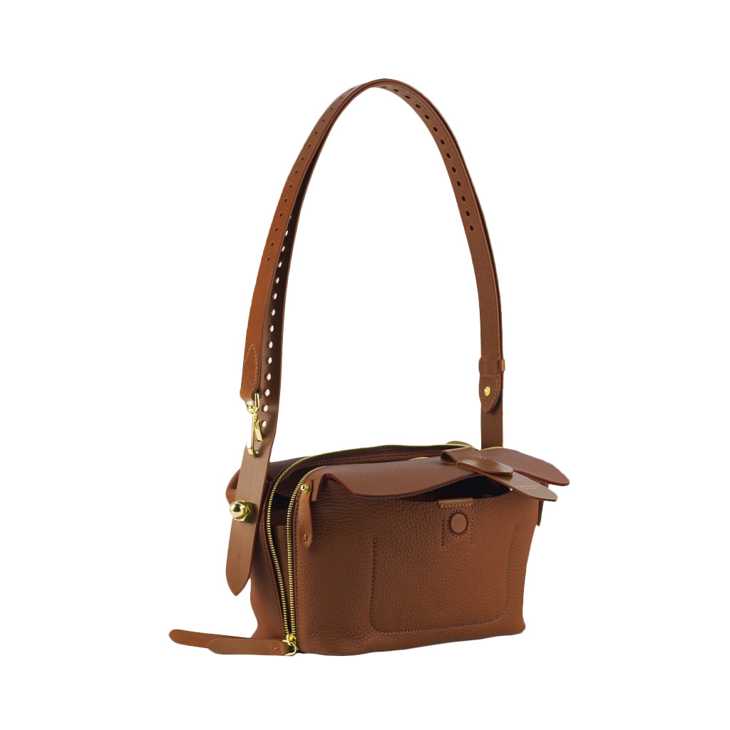 Brown leather crossbody bag with adjustable strap and gold hardware