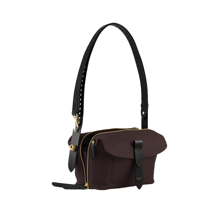 Elegant brown leather shoulder bag with black strap and gold zipper