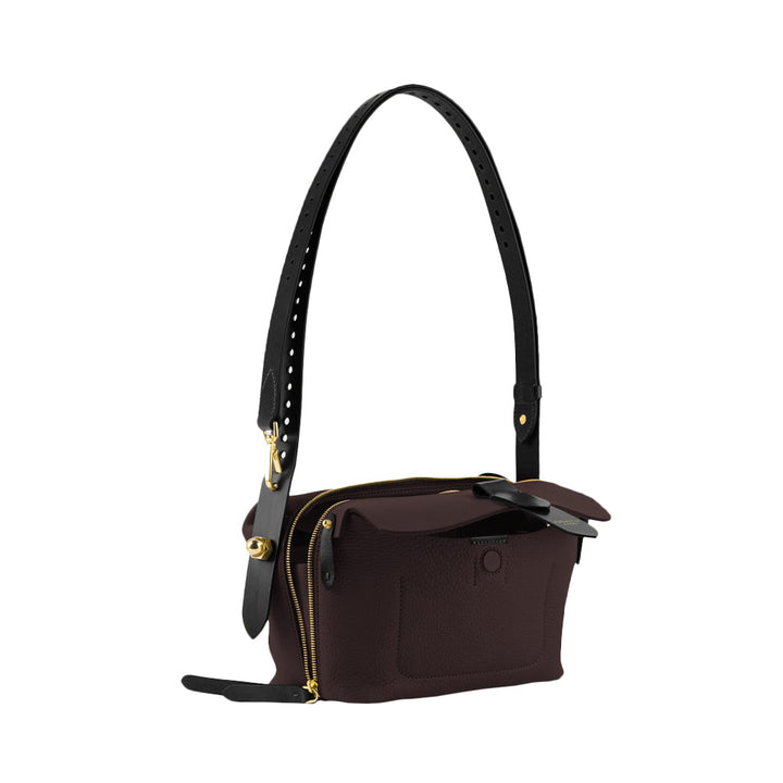 Elegant dark brown leather handbag with black adjustable strap and gold accents