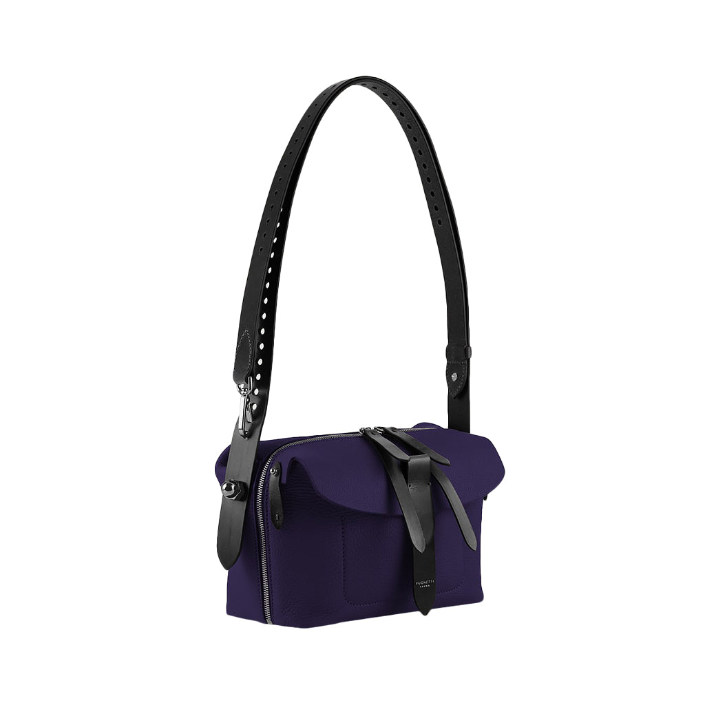 Purple shoulder bag with black leather straps and buckle closure