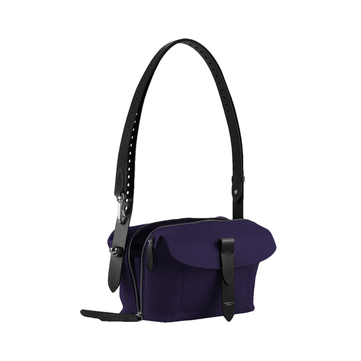 Purple shoulder bag with black adjustable strap and zipper pockets