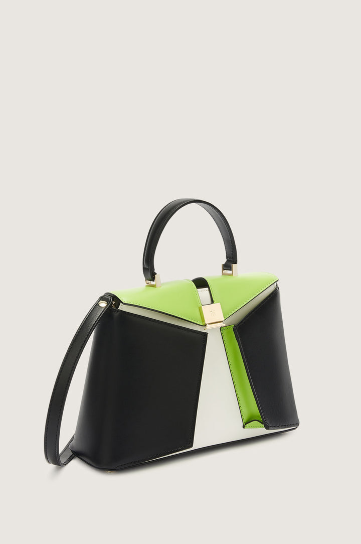 Black, white, and green designer handbag with gold accents and long strap