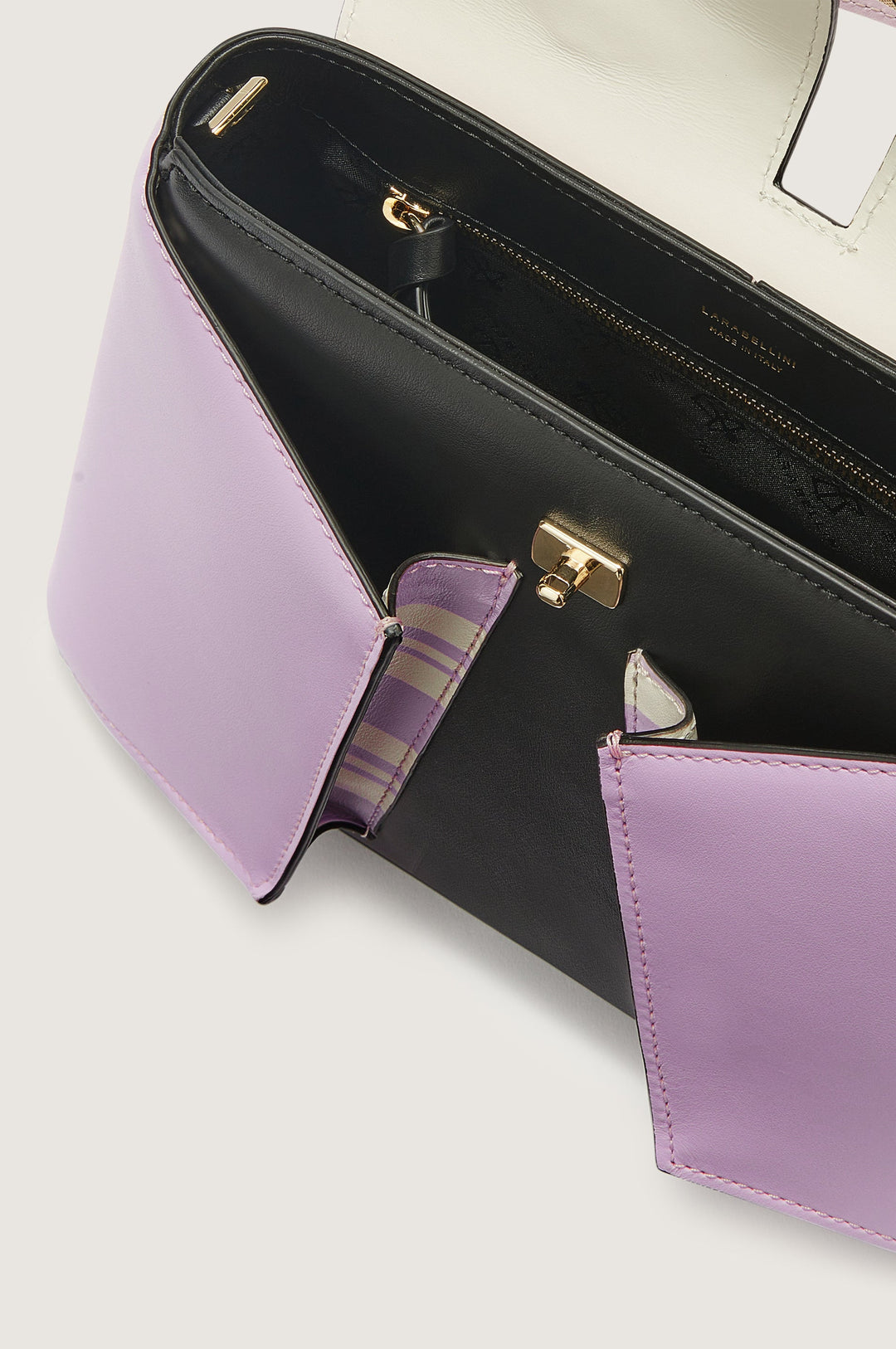 Black and lavender handbag with open compartments showing interior design