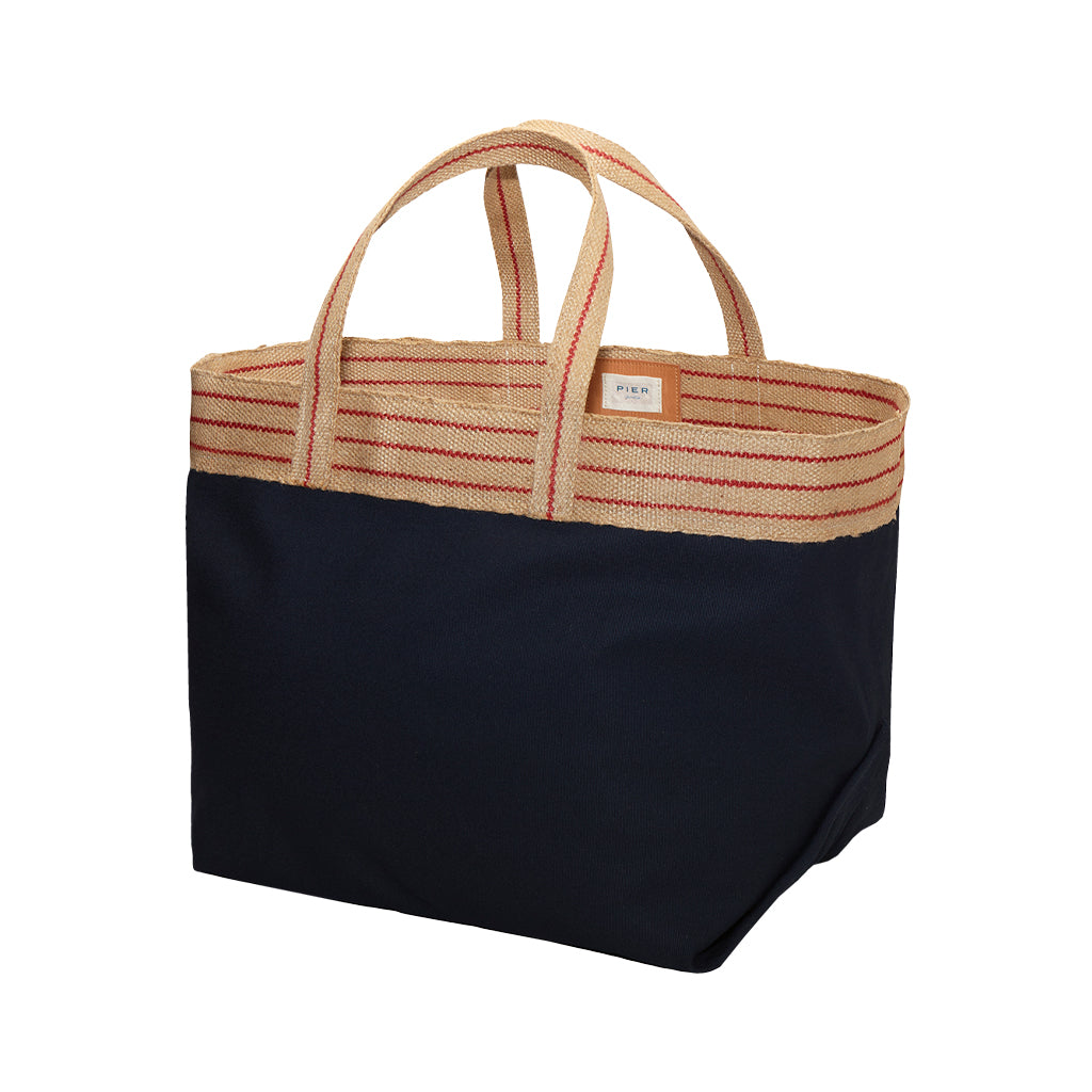 Cream and navy blue tote bag with striped handles