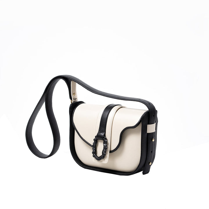 White leather crossbody bag with black strap and buckle detail