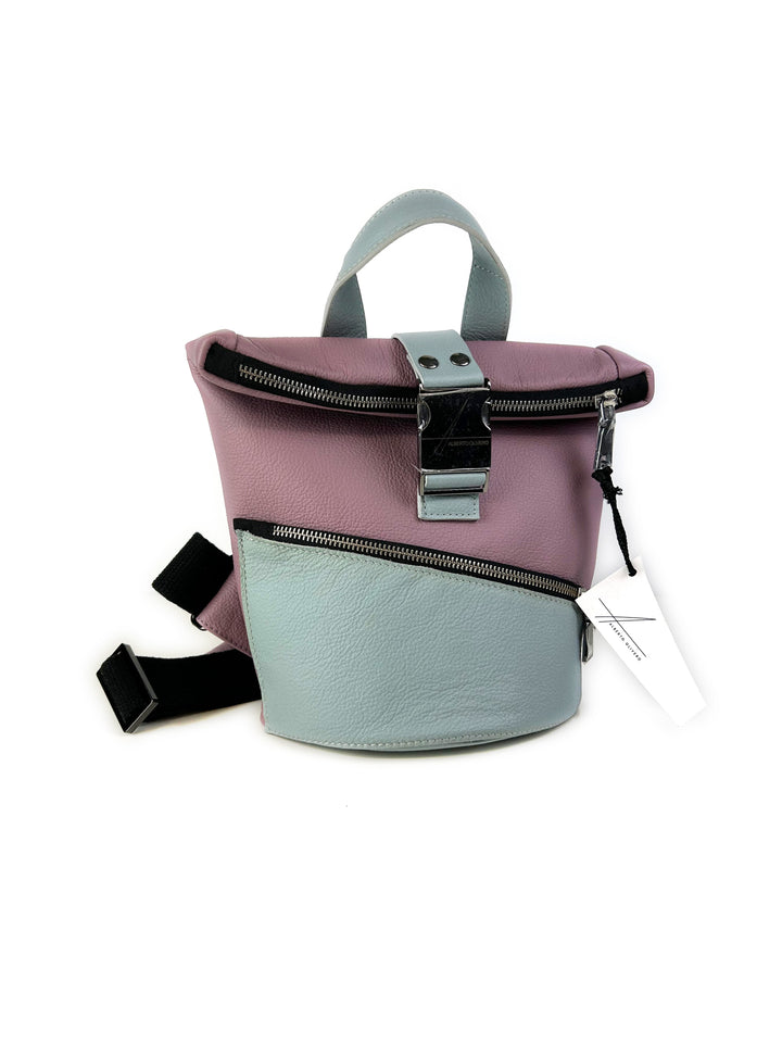 Two-tone pastel backpack with front zipper pocket and black adjustable straps