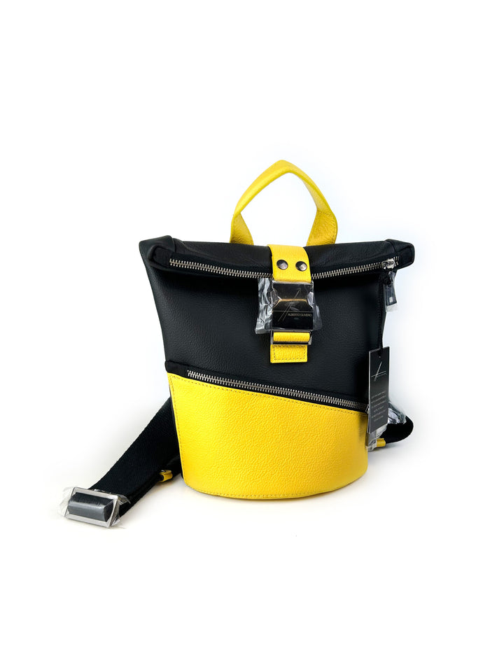 Black and yellow leather backpack with zippers and adjustable strap