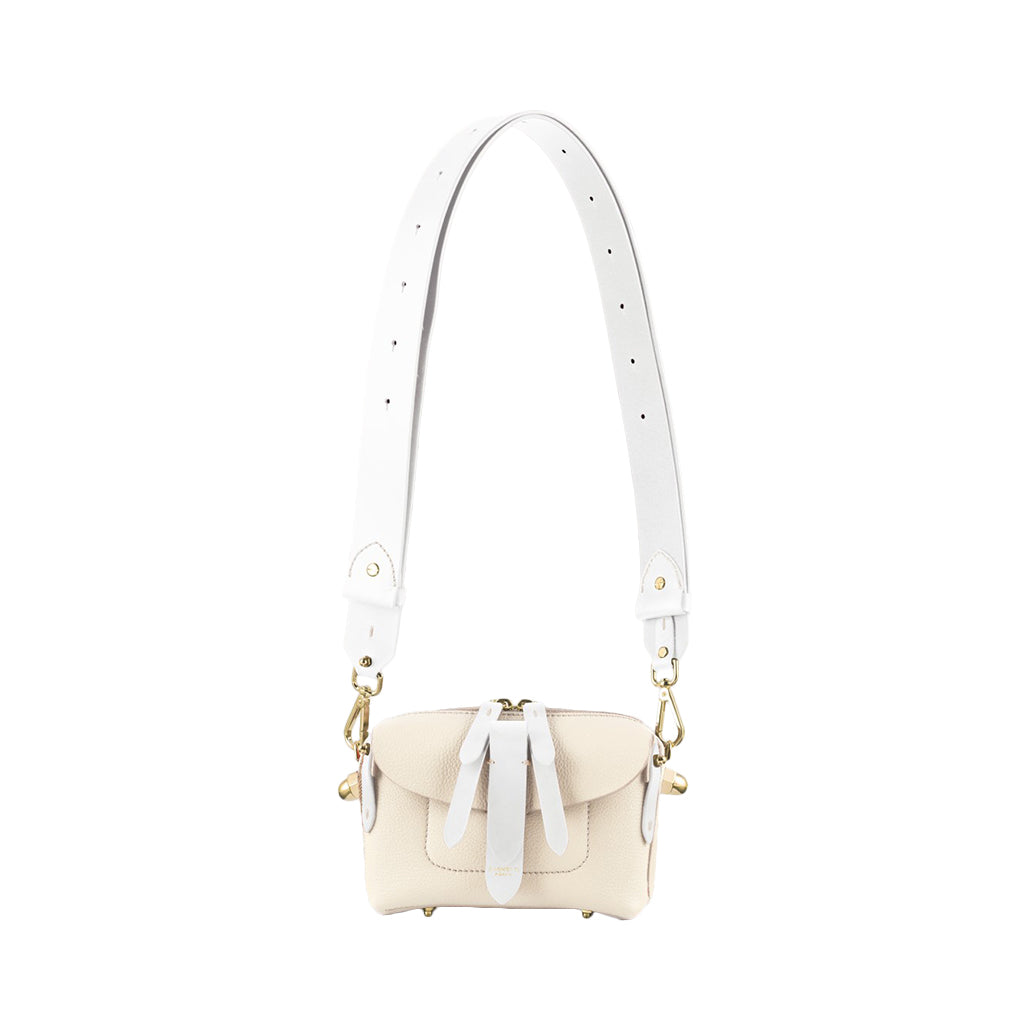 Cream and white leather shoulder bag with adjustable strap and gold hardware