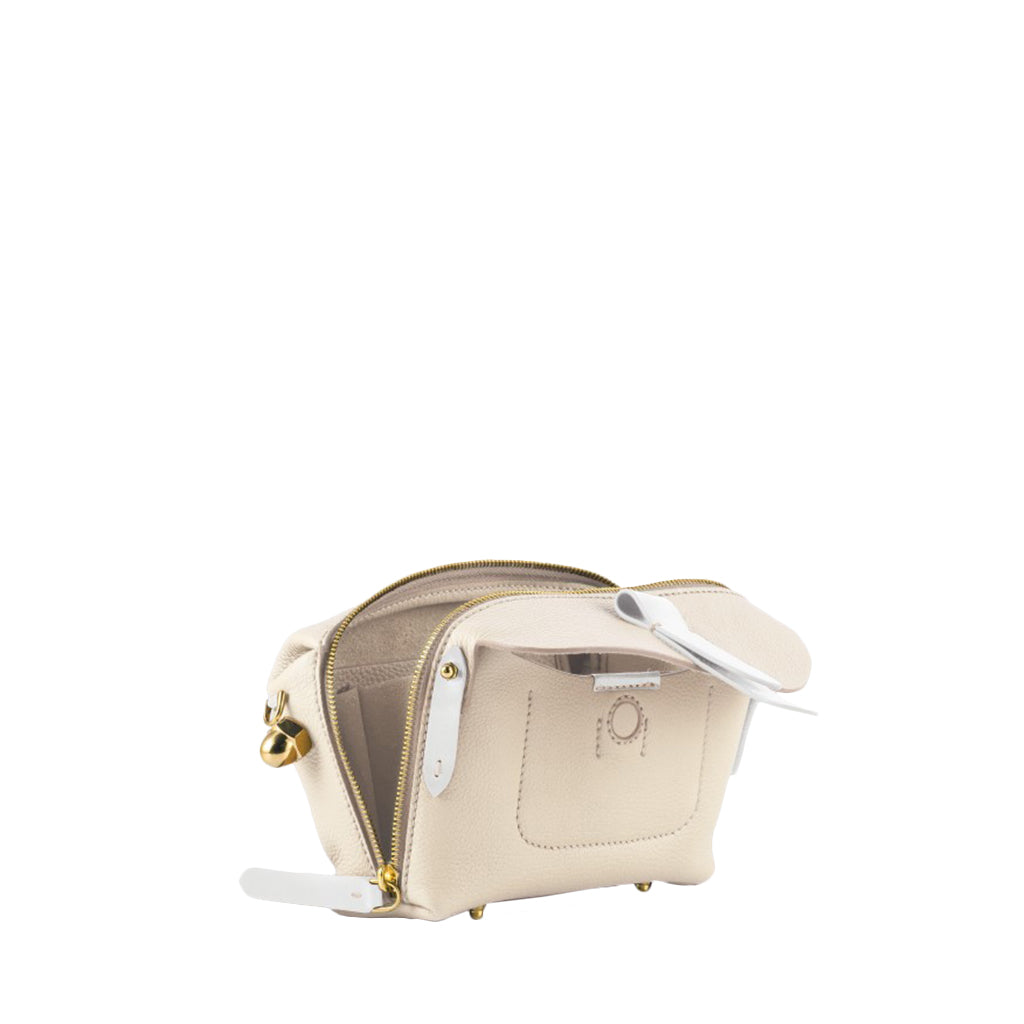 Beige leather toiletry bag with white accents and gold zippers