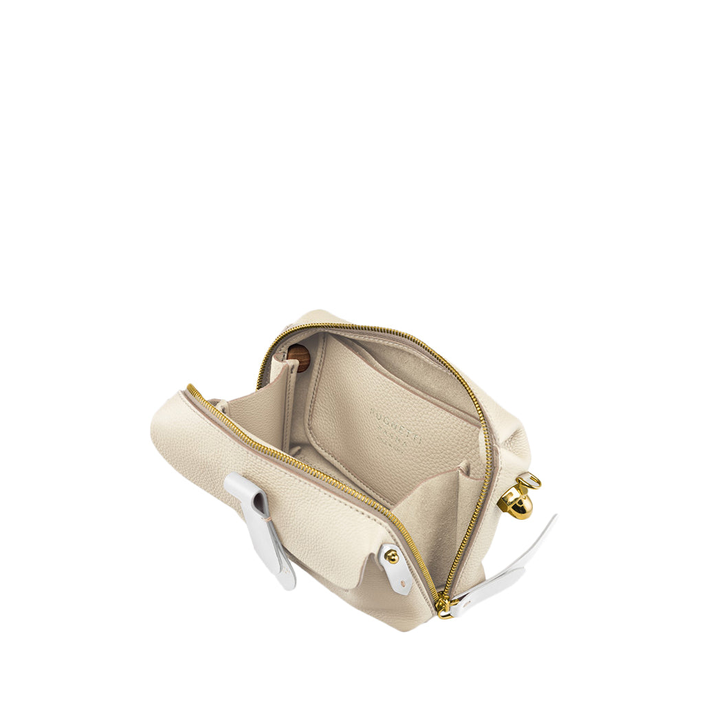 Cream leather crossbody bag with gold zipper and white accents, featuring an open interior and multiple compartments