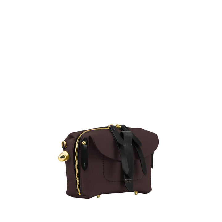 Brown leather crossbody bag with gold hardware and black strap accents