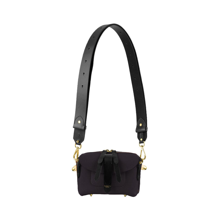 Black leather purse with adjustable strap and gold accents