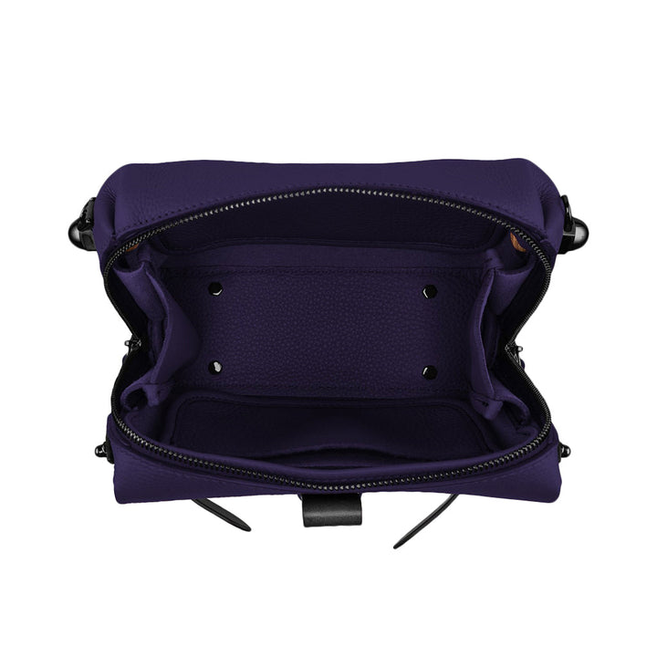 Open purple leather handbag showing interior compartments