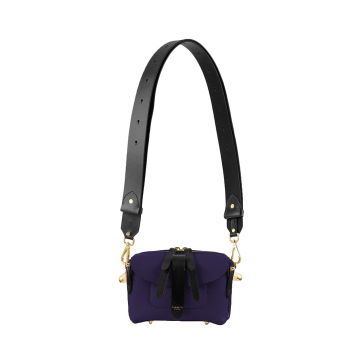 Purple and black crossbody bag with adjustable strap and gold hardware