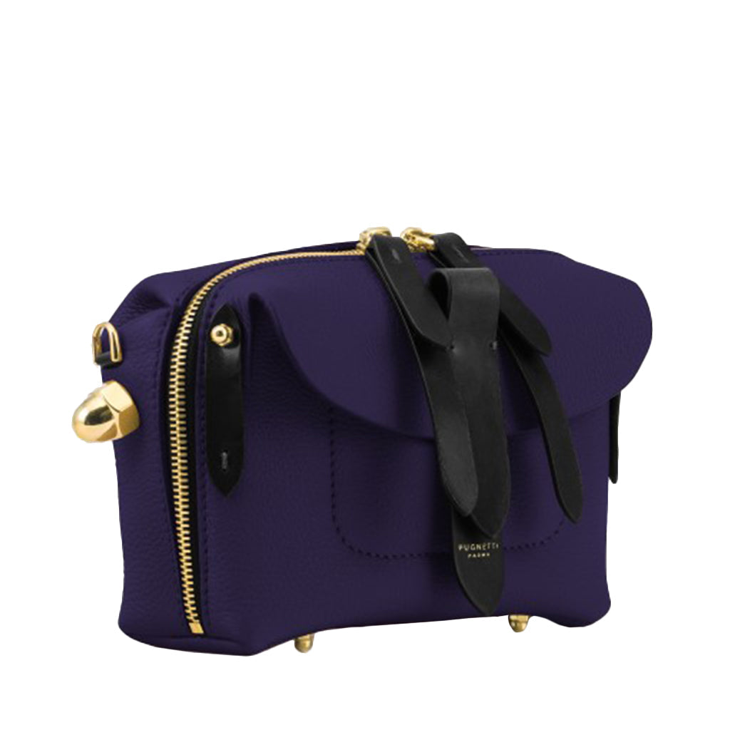 Luxurious purple leather handbag with gold hardware and black accents