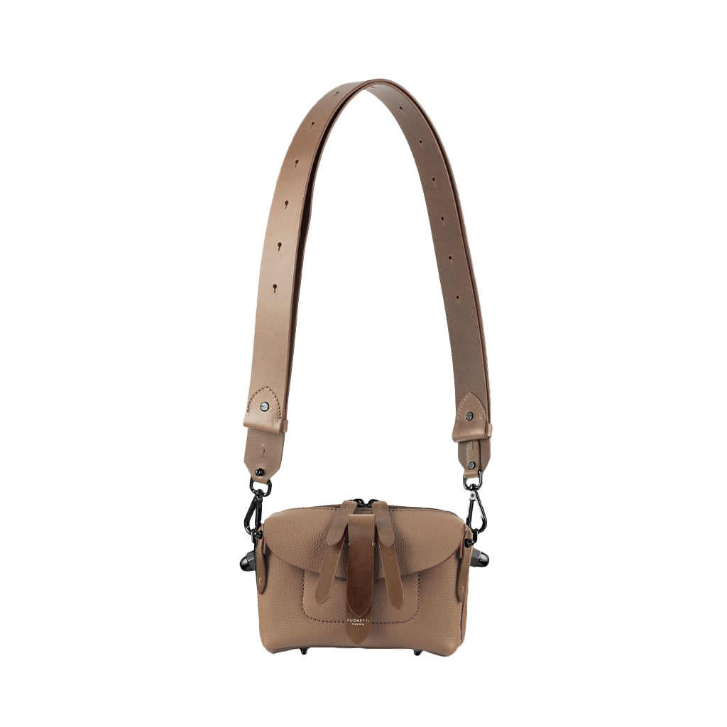 Tan leather crossbody bag with adjustable shoulder strap and front buckle detail