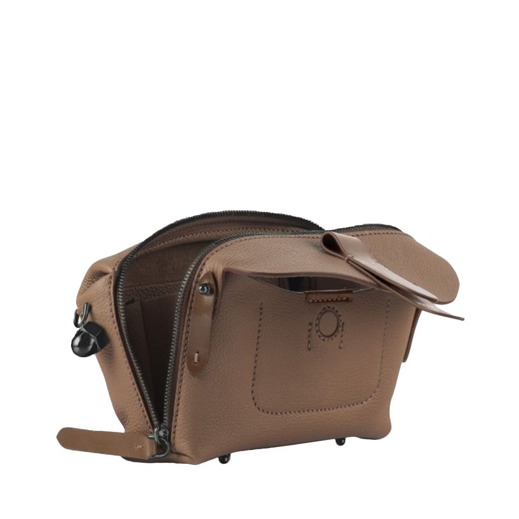 Brown leather dopp kit with open zippers and spacious interior