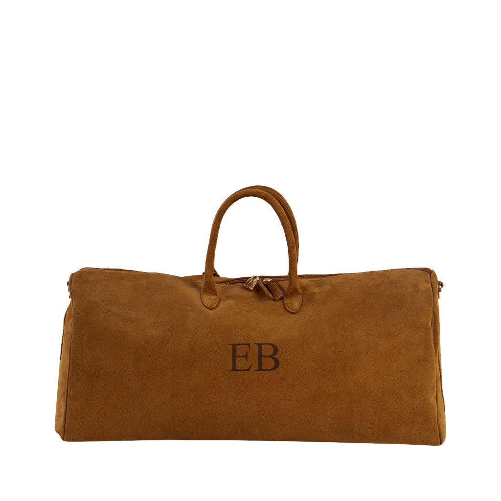 Brown suede duffel bag with monogram EB on the front and two handles