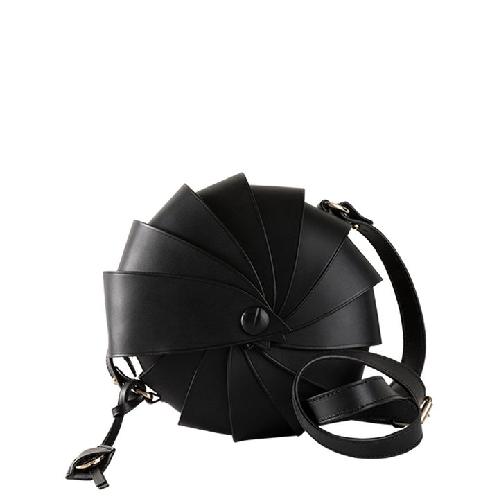 Black leather spiral handbag with adjustable strap and buckle detail