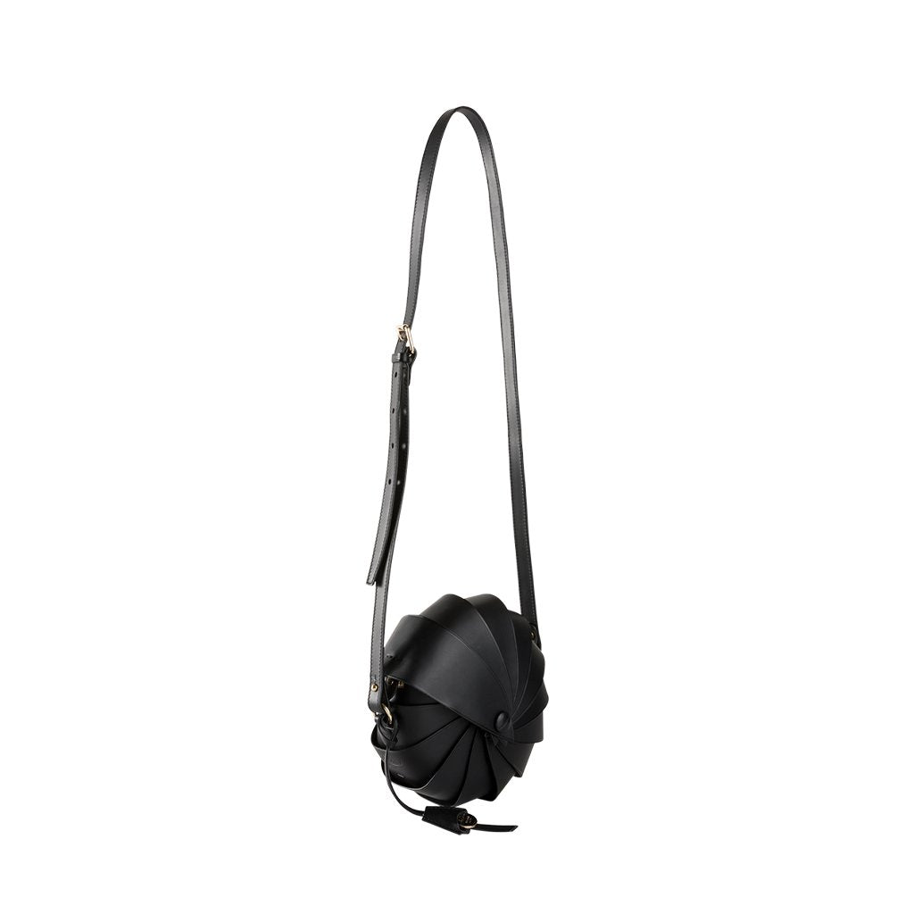 sleek black leather crossbody bag with unique pleated design