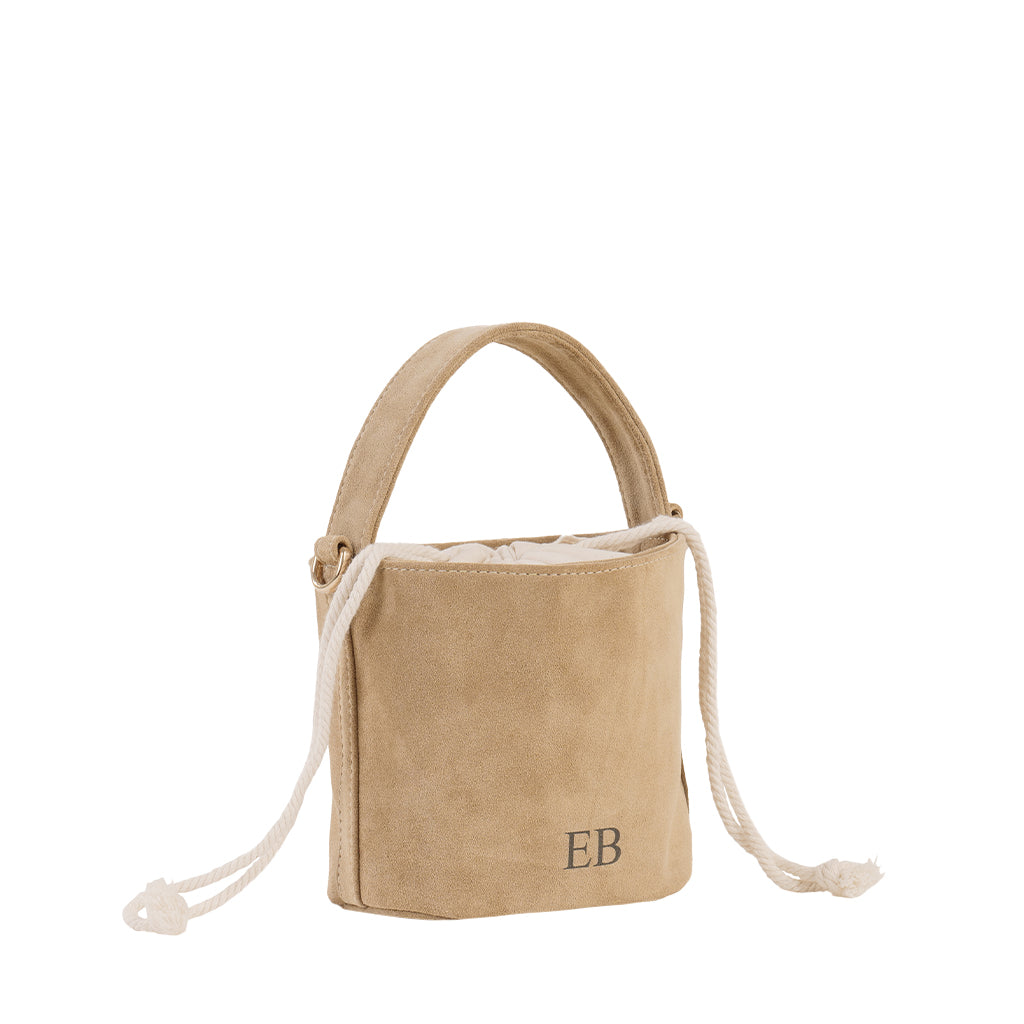Tan suede bucket handbag with rope handles and monogram initials EB on the front