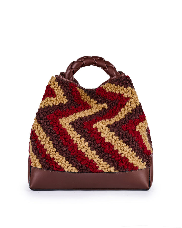 Handcrafted multi-color crochet bag with zigzag pattern and brown leather accents