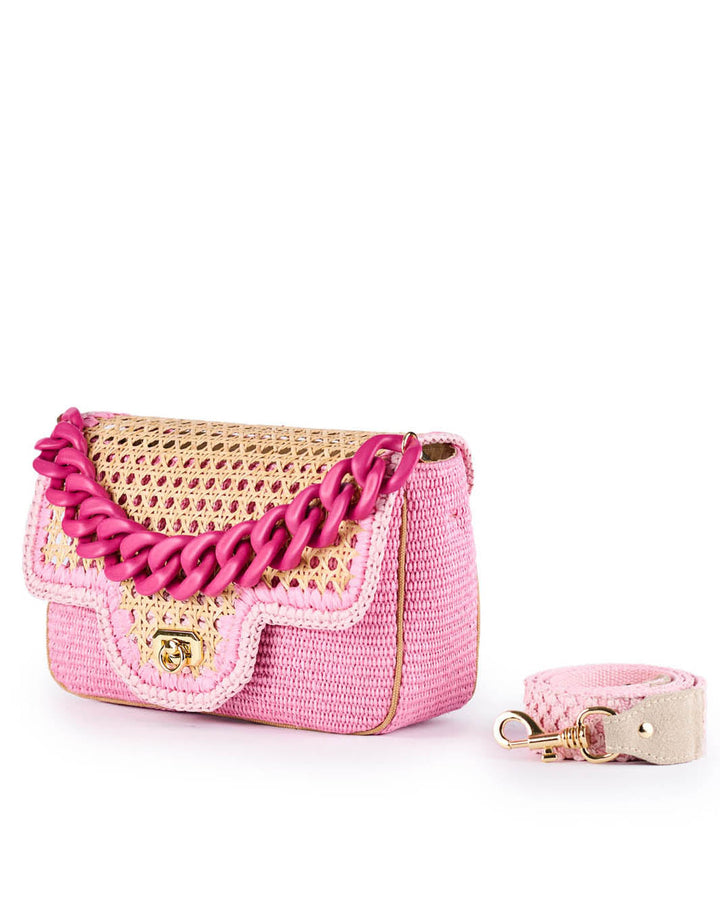 Pink woven handbag with gold accents and a large pink chain strap