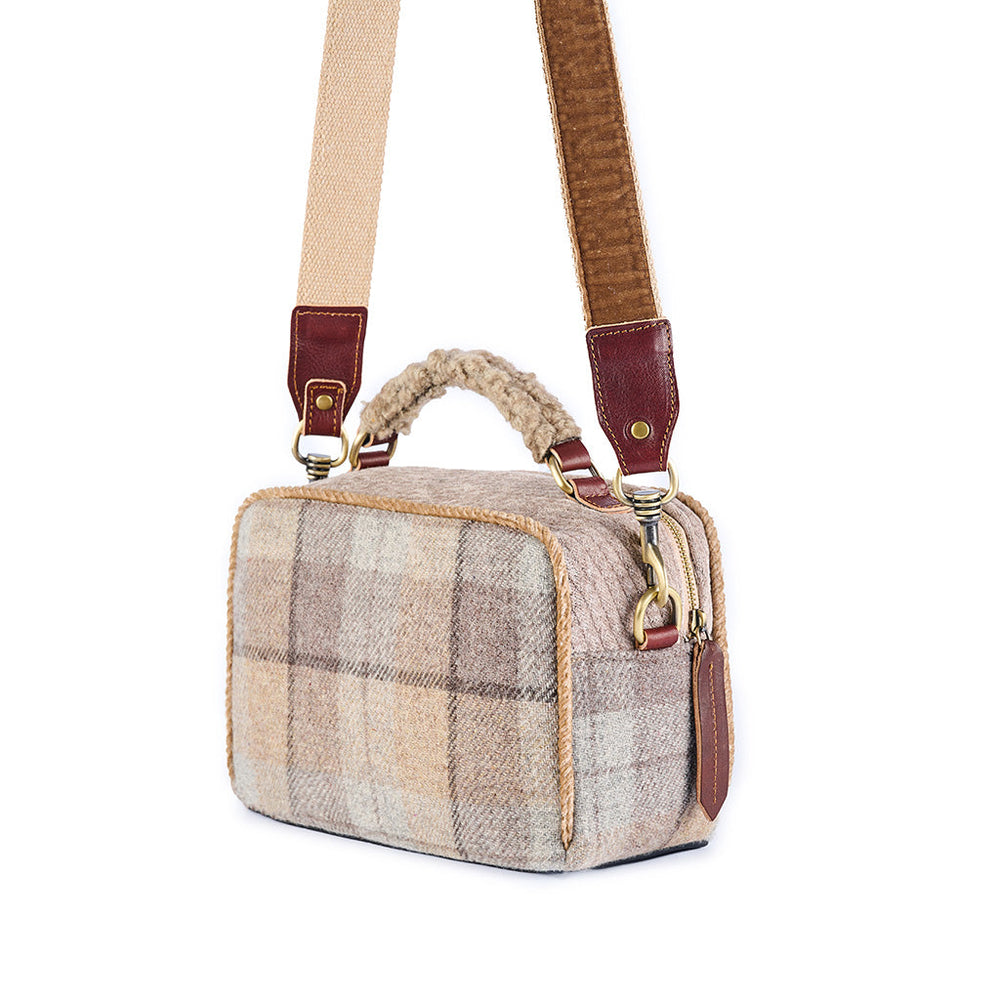 Stylish plaid handbag with brown leather strap and handle