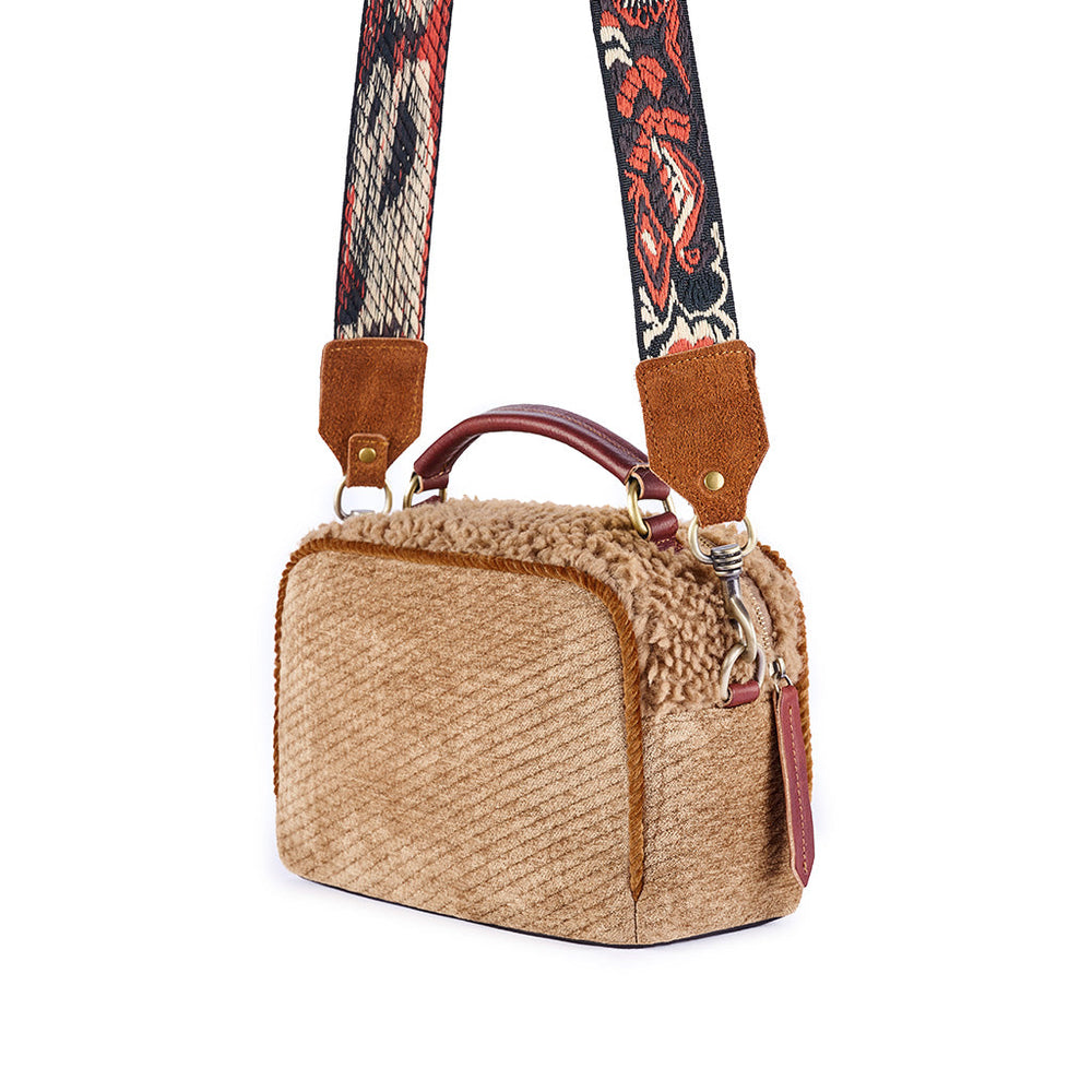 Beige corduroy handbag with a decorative strap