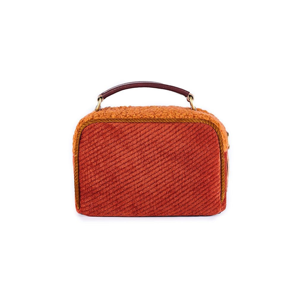 Rustic orange and red textured handbag with a top handle