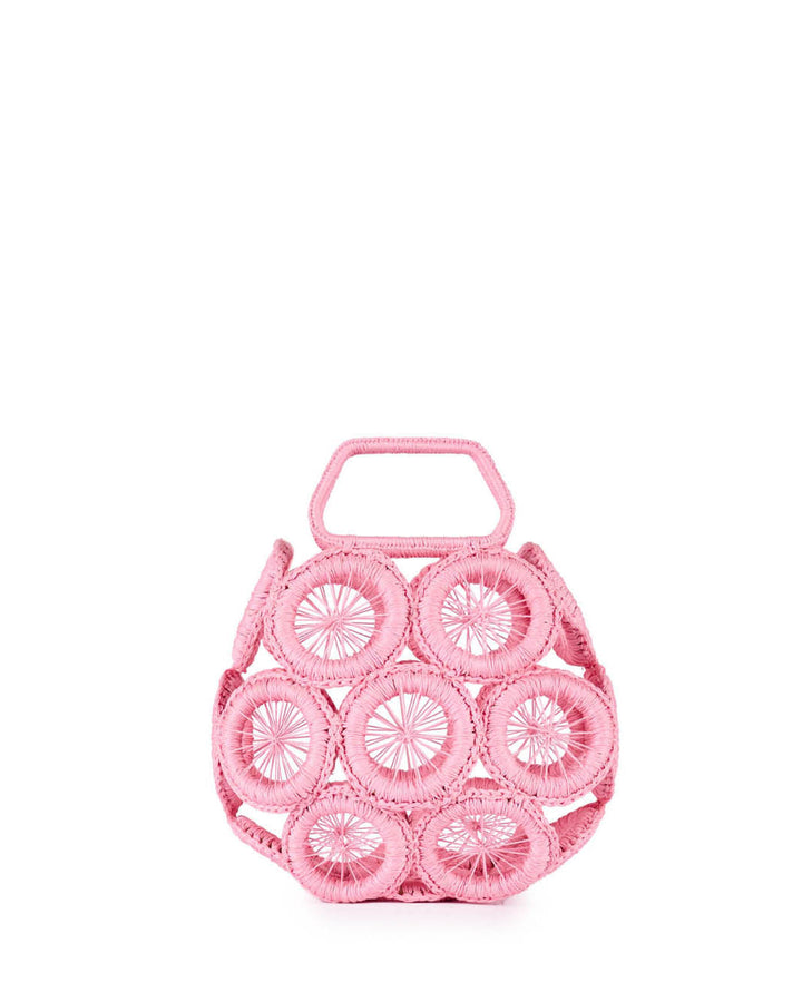 Pink geometric pattern handbag with circular designs and top handle