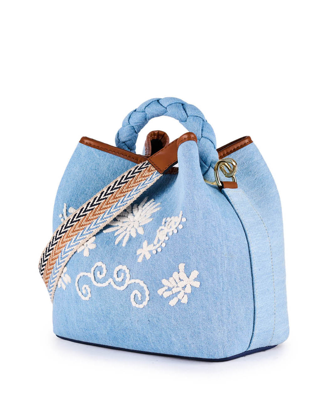 Light blue denim handbag with white floral embroidery and braided strap